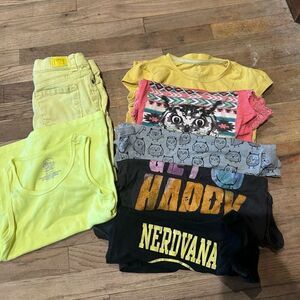 Bundle of seven girls shorts and short sleeve tops, size medium 7–8